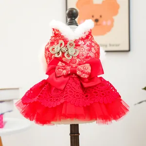 Chinese style red pet dress with gold floral patterns and white faux fur collar