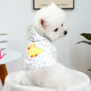 Close-up of pet hoodie featuring yellow duck embroidery and colorful dot patterns