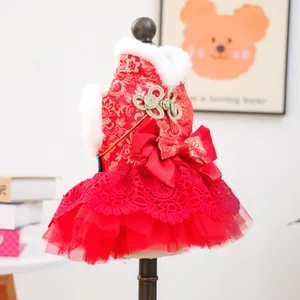 Detail of red Chinese style pet dress with golden flower embroidery and fur collar