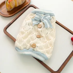 Knitted pet vest with argyle pattern, blue stripes, and wooden buttons for small dogs and cats