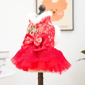 Detail of red Chinese style dog dress with faux fur collar and satin bow for New Year