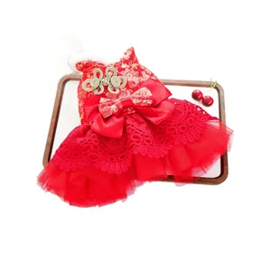 Festive red pet cheongsam dress with floral embroidery and white faux fur collar