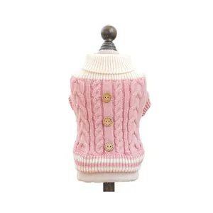Pink chunky knit pet sweater with white collar and three wooden buttons for dogs or cats