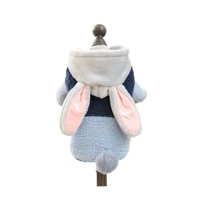 Cozy grey and blue rabbit-themed dog fleece hoodie with bunny ears on wood hanger