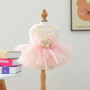 Charming pink pet tutu dress featuring a large bow and flower detail for small dogs and cats