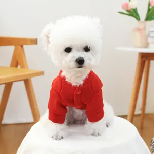 Close-up of a cozy red pet jacket featuring warm fleece texture and secure button closure