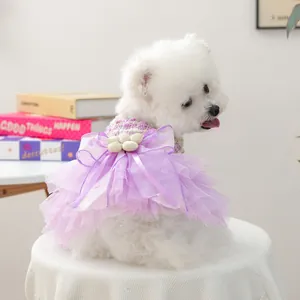 Cute purple pet tutu dress for small dogs with multi-layer mesh bow and flower details.