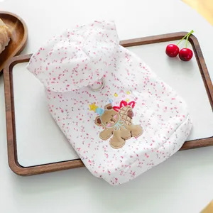Detail view of pet hoodie with bear embroidery and metal D-ring for leash attachment