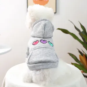 Detail of light grey pet hoodie featuring 'BE MINE' and 'LOVE YOU' heart embroidery