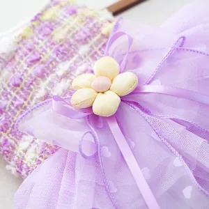 Purple pet mesh tutu dress detail featuring cute yellow flower and sweet ribbon bows.