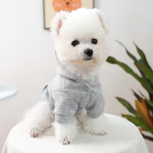 Close-up of a grey pet hoodie with snap buttons on a white dog for Valentine's Day