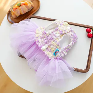 Detailed view of cute purple tweed and mesh pet tutu dress for small dogs and puppies.