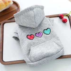 Detail of grey dog hoodie featuring heart embroidery with Be Mine and Love You text