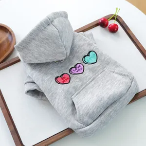 Grey pet hoodie detail with embroidered hearts, kangaroo pocket and metal D-ring leash attachment