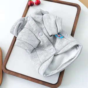 Detail of warm grey pet fleece sweater with snap buttons and a rocket badge