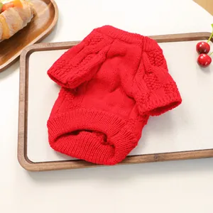 Detail of red cable knit pet sweater showing soft texture and warm winter fabric