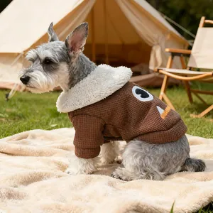 Detail of waffle-textured dog sweater with faux shearling collar in outdoor camping setting