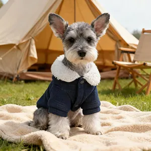 Navy corduroy pet winter jacket with white fleece collar on a Schnauzer dog outdoors