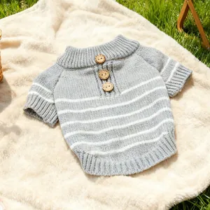 Knitted striped dog sweater with wooden buttons and ribbed cuffs on soft lawn
