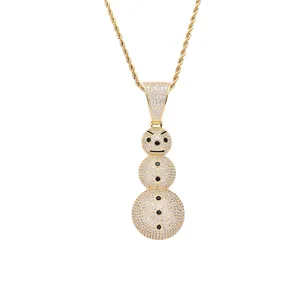 Macro shot of hip hop snowman pendant with sparkling white zircons and gold rope chain