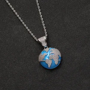 Iced out blue ocean globe pendant necklace with sparkling cubic zirconia on silver rope chain