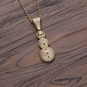 Iced out snowman hip hop pendant necklace in gold plating with pave set cubic zirconia