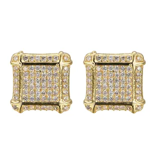 Detailed macro view of square iced-out stud earrings with gold plating and cubic zirconia
