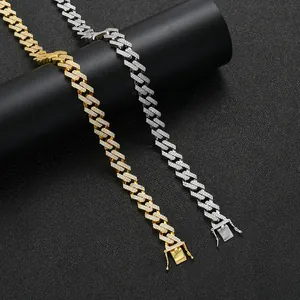 Detailed view of 13mm gold and silver iced out diamond-cut rhombic Cuban link chains