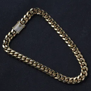 Detail of 14mm golden Cuban link necklace featuring a box clasp with iced-out rhinestones
