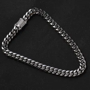 Close-up of 14mm silver cuban chain necklace with micro-paved zircon on box clasp