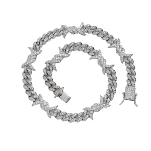 Macro detail of silver hip hop Cuban link chain with thorn design and full zircon inlay