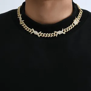 Detailed view of 10mm gold Cuban link chain with thorn design and full zircon inlay
