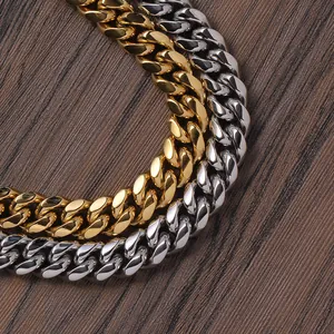 Macro shot of gold and silver high-polish Cuban link chains on a rustic wood background