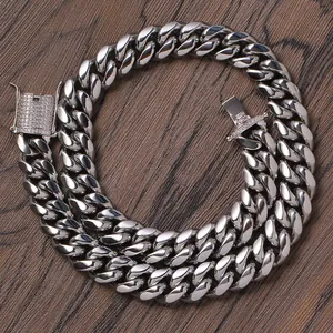 Macro detail of 14mm Cuban link chain with sparkling diamond-set box clasp closure