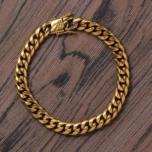 Close-up of gold stainless steel Cuban chain bracelet with a secure textured box clasp