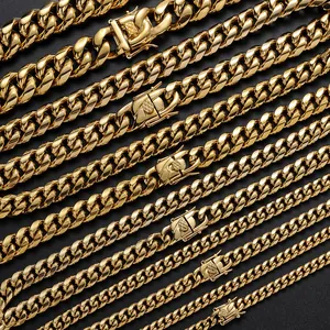 Macro detail of golden Cuban link chains in various widths with square textured clasps