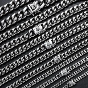 Polished stainless steel Cuban link necklaces for men in various widths on black background