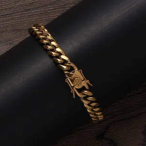 Detailed close-up of gold stainless steel Cuban link bracelet with secure box clasp