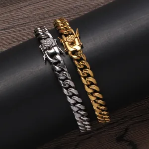 Detailed view of gold and silver Cuban link bracelets with secure clasp on display