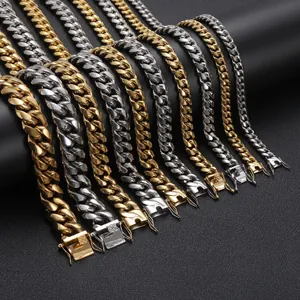 Macro view of stainless steel Cuban link chains with secure box clasp in gold and silver