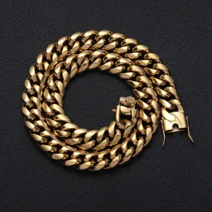 Detailed macro view of heavy gold-plated stainless steel Cuban link chain with box clasp
