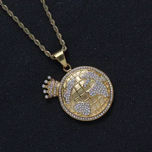Macro shot of hip-hop gold crown globe pendant with iced-out cubic zirconia stones