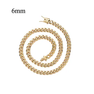 Close-up of 6mm wide gold Cuban link chain with a secure double-lock clasp in hiphop style