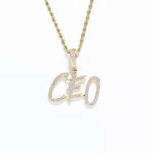 Macro detail of gold-plated CEO letter pendant with sparkling micro-pave zircons