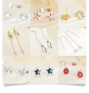 Close-up of nine elegant 925 silver stud earring designs with pearls and zircons
