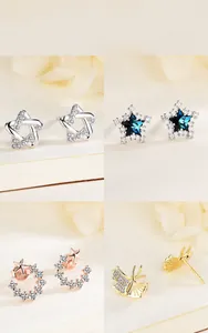 Detailed views of sterling silver stud earrings in star, snowflake, moon, and leaf designs