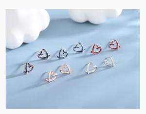 Detail of heart-shaped enamel stud earrings in multiple colors with S925 silver frames