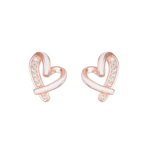 Rose gold heart stud earrings with white enamel and zircon accents on white background