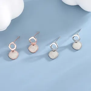 Geometric silver stud earrings with marble enamel drops in rose gold and silver finishes