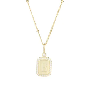 Elegant gold letter B pendant necklace with micro-pave crystals and delicate bead chain